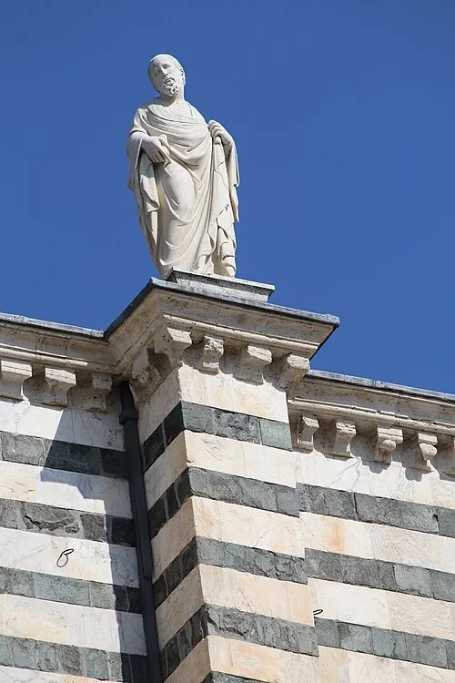 Statue on Striped Walls