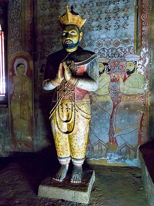 Statue of King Kirti Sri Rajasinha — Dambulla cave temple audio guide stop