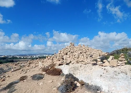false cairns at Tombs of the Kings in Paphos — Tombs of the Kings audio guide stop